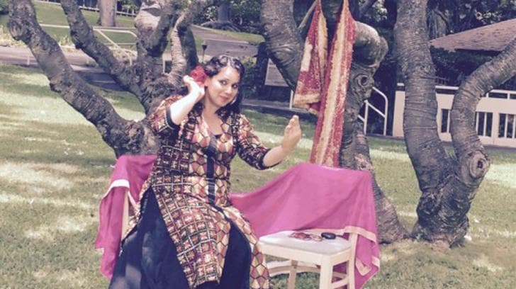 Dr. Dimple Kaur seated outdoors under a tree